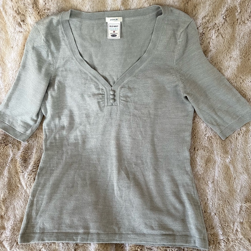Sweet v neck sweater with button detail. Worn minimally.